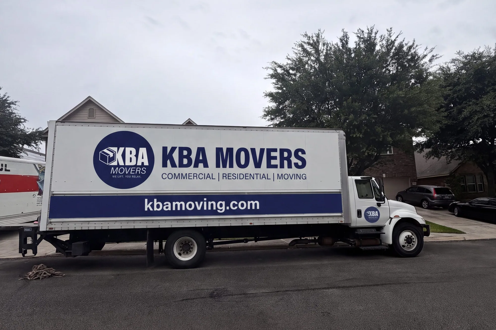 KBA Movers box truck parked on a residential street
